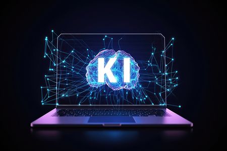 Notebook, auf Bildschirm steht gro&szlig; KI